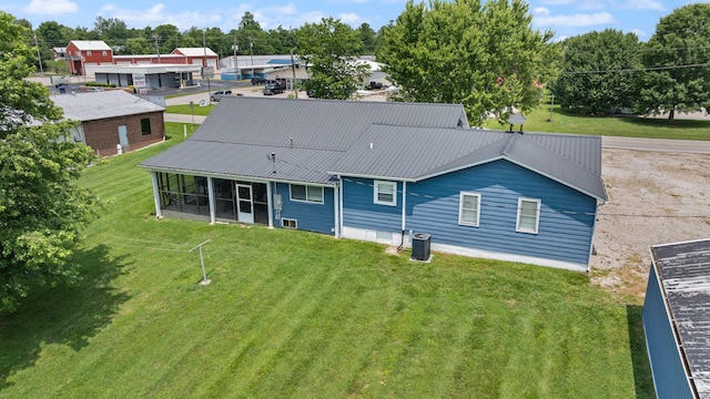 9209 W Hwy 80, Nancy, KY 42544 - rear view of house featuring a sunroom, a lawn, and a metal roof