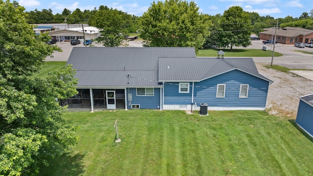 9209 W Hwy 80, Nancy, KY 42544 - back of property featuring a sunroom, a yard, and a metal roof