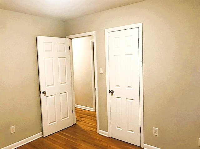 1984 Greenleaf Dr, Lexington, KY 40505 - unfurnished bedroom with dark wood finished floors and baseboards