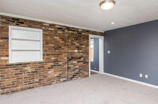 1984 Greenleaf Dr, Lexington, KY 40505 - empty room with carpet, brick wall, healthy amount of natural light, and ornamental molding