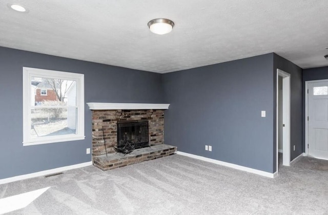 1984 Greenleaf Dr, Lexington, KY 40505 - unfurnished living room featuring carpet, a brick fireplace, and a textured ceiling