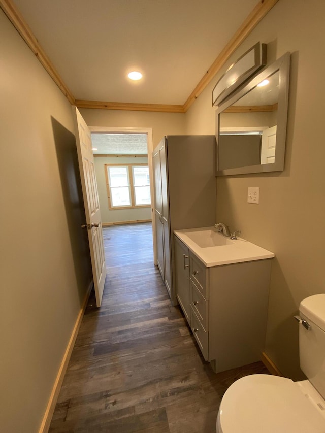 618 N College St, Somerset, KY 42503 - bathroom with vanity, wood finished floors, ornamental molding, and recessed lighting