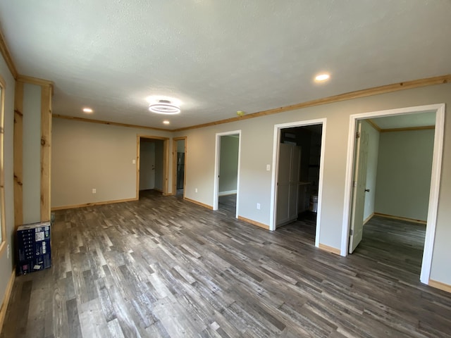 618 N College St, Somerset, KY 42503 - unfurnished bedroom featuring wood finished floors, recessed lighting, ornamental molding, a walk in closet, and ensuite bathroom