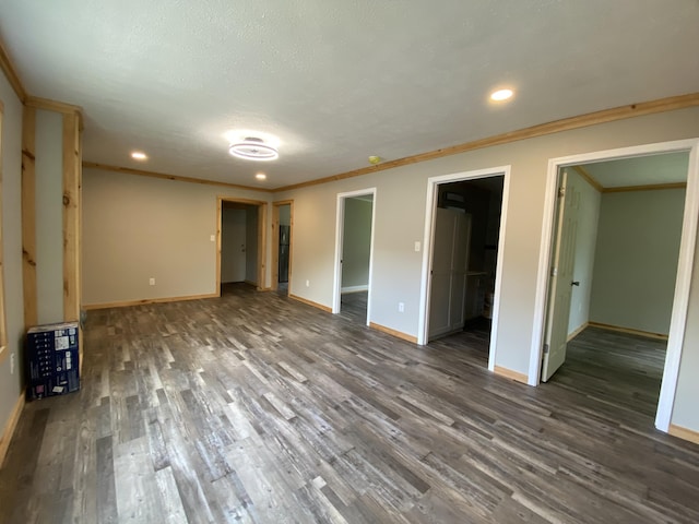 618 N College St, Somerset, KY 42503 - unfurnished bedroom featuring wood finished floors, recessed lighting, ornamental molding, and a walk in closet