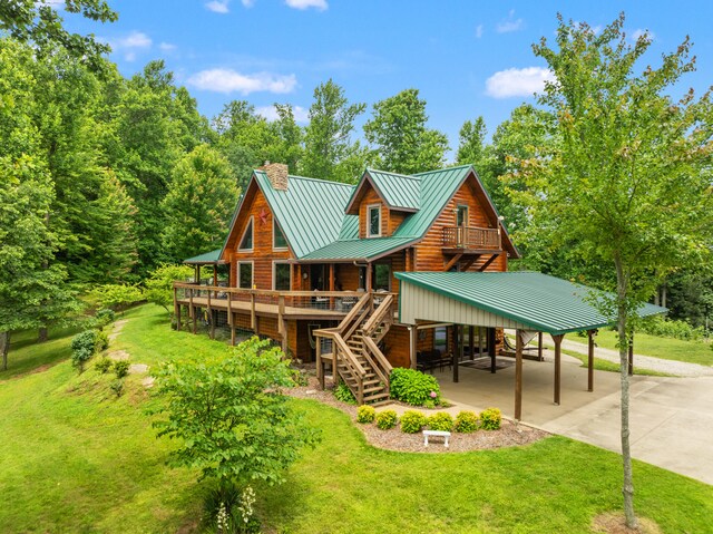 1564 High Ridge Rd, Middleburg, KY 42541 - rear view of property with stairway, concrete driveway, a yard, a metal roof, and a carport