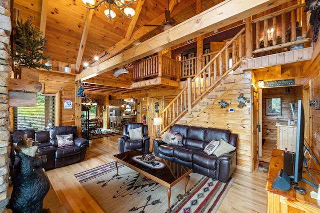 1564 High Ridge Rd, Middleburg, KY 42541 - living area featuring wood walls, wood finished floors, stairway, high vaulted ceiling, and a wooden ceiling with exposed beams