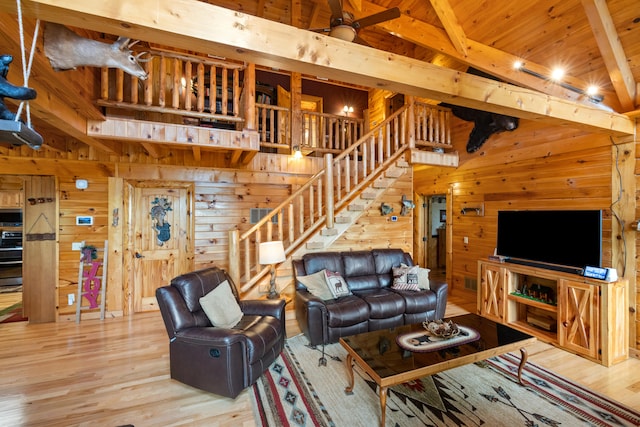 1564 High Ridge Rd, Middleburg, KY 42541 - living area featuring wood walls, stairway, wood finished floors, and a wood ceiling with exposed beams