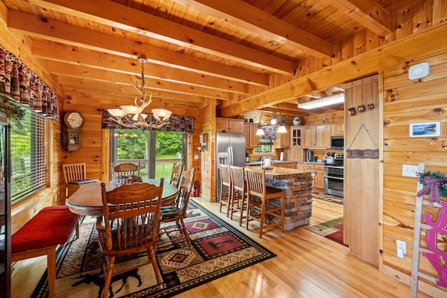 1564 High Ridge Rd, Middleburg, KY 42541 - dining area featuring a chandelier, wood walls, light wood-style floors, and a wooden ceiling with exposed beams