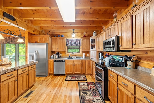 1564 High Ridge Rd, Middleburg, KY 42541 - kitchen featuring appliances with stainless steel finishes, a wooden ceiling with exposed beams, light wood finished floors, decorative light fixtures, and glass insert cabinets