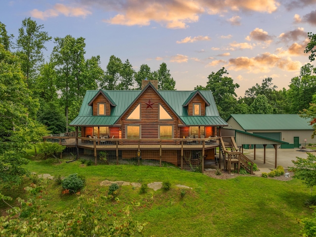 1564 High Ridge Rd, Middleburg, KY 42541 - rear view of property with a chimney, a yard, a wooden deck, and a metal roof