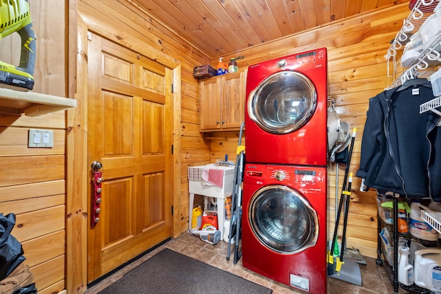 1564 High Ridge Rd, Middleburg, KY 42541 - laundry room featuring stacked washer / dryer, cabinet space, wooden walls, and wood ceiling