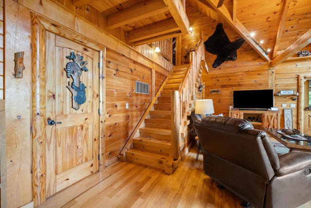 1564 High Ridge Rd, Middleburg, KY 42541 - living area with wooden walls, a wood ceiling with exposed beams, light wood-type flooring, and stairs