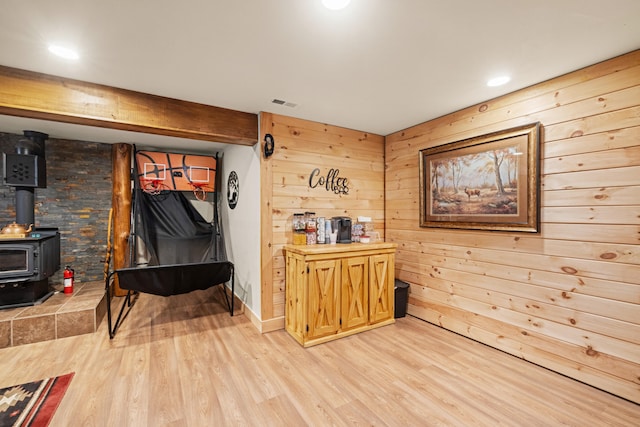 1564 High Ridge Rd, Middleburg, KY 42541 - living area featuring light wood-style floors, a wood stove, wood walls, and recessed lighting
