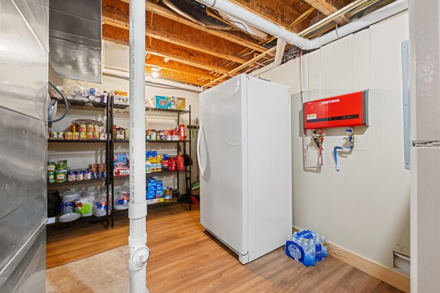 1564 High Ridge Rd, Middleburg, KY 42541 - unfinished basement featuring freestanding refrigerator and wood finished floors