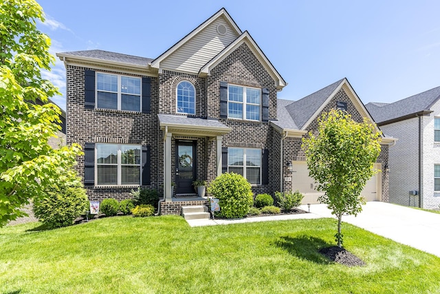 3536 Night Heron Way, Lexington, KY 40515 - traditional home with brick siding, concrete driveway, a front lawn, and a garage