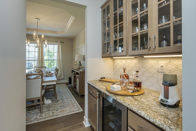 3536 Night Heron Way, Lexington, KY 40515 - indoor dry bar featuring crown molding, tasteful backsplash, wine cooler, dark wood-type flooring, and a raised ceiling