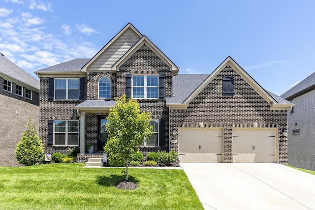 3536 Night Heron Way, Lexington, KY 40515 - traditional home with brick siding, driveway, a front yard, a garage, and a shingled roof