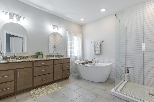 3536 Night Heron Way, Lexington, KY 40515 - full bath featuring tile walls, a soaking tub, double vanity, a stall shower, and wainscoting