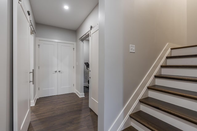 3536 Night Heron Way, Lexington, KY 40515 - hallway featuring a barn door, dark wood-style floors, stairway, and recessed lighting