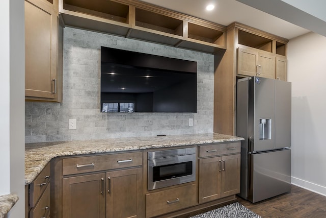 3536 Night Heron Way, Lexington, KY 40515 - kitchen with appliances with stainless steel finishes, dark wood-type flooring, tasteful backsplash, and light stone counters