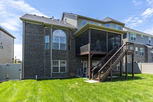 3536 Night Heron Way, Lexington, KY 40515 - back of property with a sunroom, a gate, a fenced backyard, brick siding, and stairs