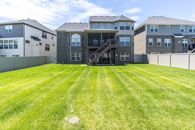 3536 Night Heron Way, Lexington, KY 40515 - back of property with a sunroom, stairway, and a fenced backyard