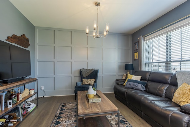 3536 Night Heron Way, Lexington, KY 40515 - living area with a decorative wall, a chandelier, and wood finished floors