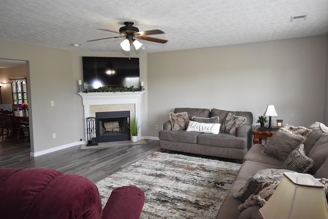 2340 Mulundy Way, Lexington, KY 40511 - living room featuring a ceiling fan, wood finished floors, a fireplace with flush hearth, and a textured ceiling
