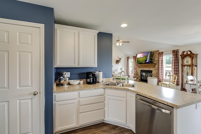 1011 Brown Store Rd, Lawrenceburg, KY 40342 - kitchen featuring dishwasher, a peninsula, ceiling fan, a brick fireplace, and open floor plan