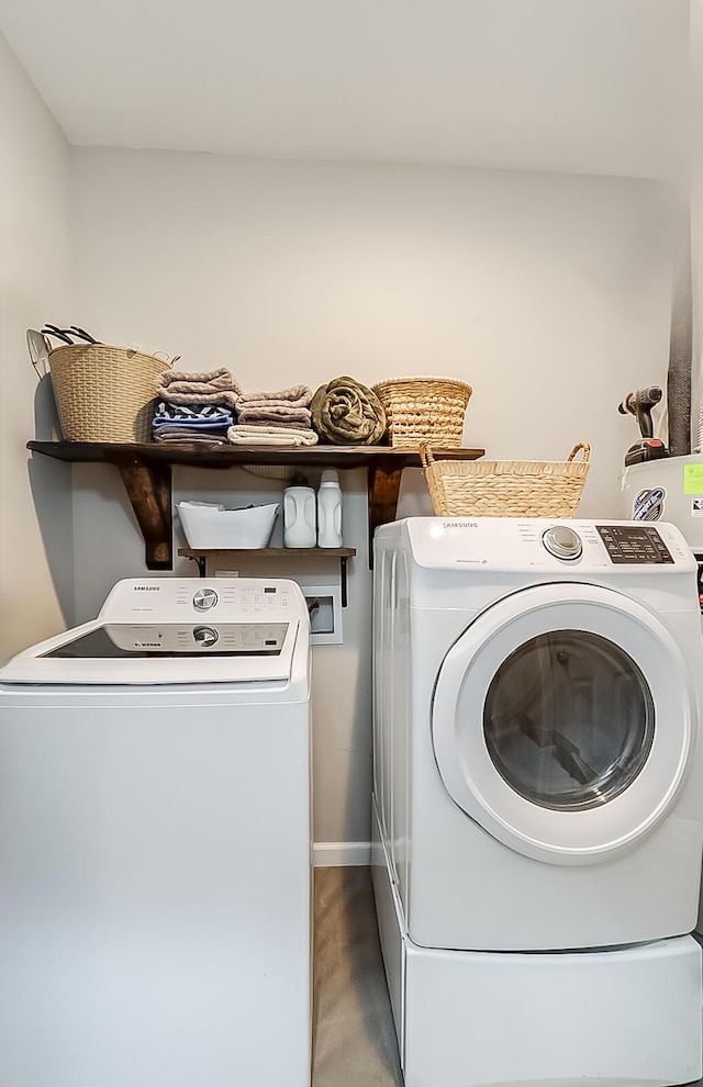 1011 Brown Store Rd, Lawrenceburg, KY 40342 - laundry room featuring washing machine and clothes dryer and wood finished floors