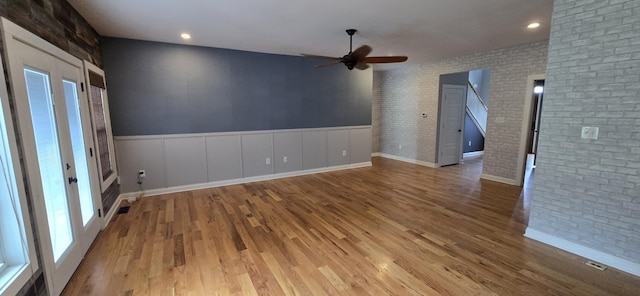4020 Greentree Rd, Versailles, KY 40383 - empty room with a ceiling fan, wood finished floors, brick wall, recessed lighting, and wainscoting