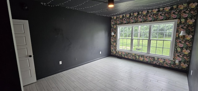 4020 Greentree Rd, Versailles, KY 40383 - empty room featuring wallpapered walls and wood finished floors