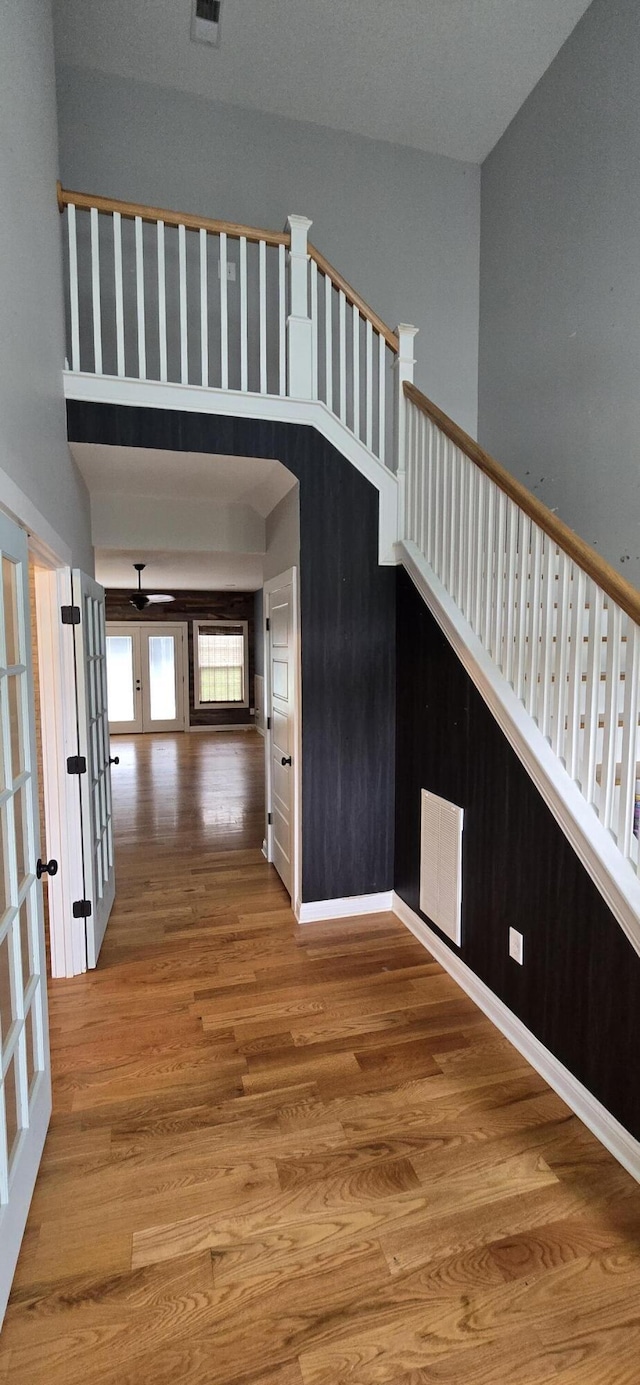 4020 Greentree Rd, Versailles, KY 40383 - stairway with french doors and wood finished floors