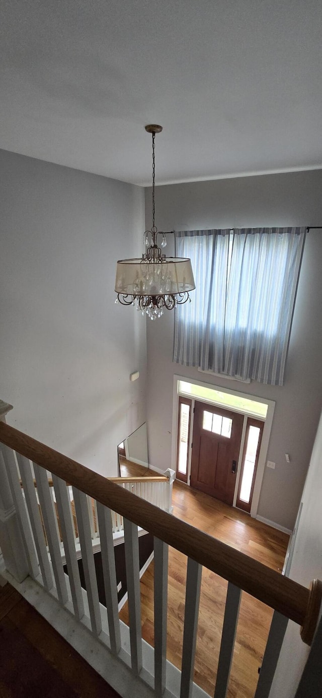 4020 Greentree Rd, Versailles, KY 40383 - foyer featuring a chandelier, wood finished floors, and a towering ceiling
