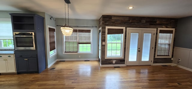 4020 Greentree Rd, Versailles, KY 40383 - unfurnished dining area with wood finished floors, a chandelier, and french doors