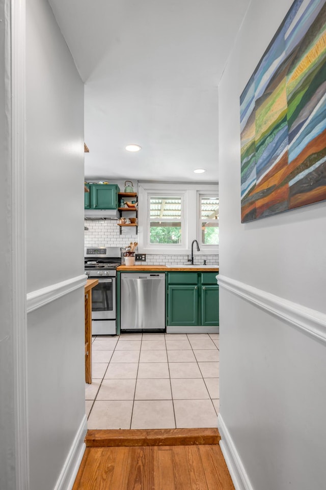 334 Oldham Ave, Lexington, KY 40502 - kitchen with stainless steel appliances, green cabinets, light tile patterned flooring, backsplash, and recessed lighting