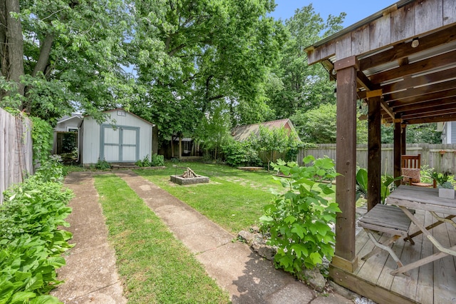 334 Oldham Ave, Lexington, KY 40502 - fenced backyard featuring a fire pit and a storage shed