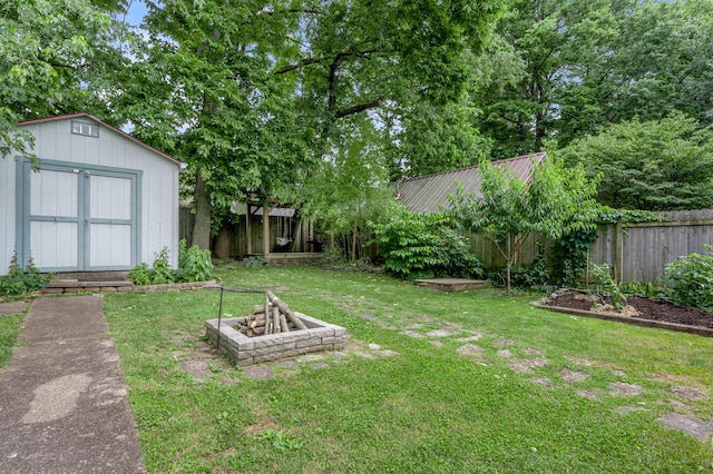 334 Oldham Ave, Lexington, KY 40502 - fenced backyard with a storage shed and a fire pit