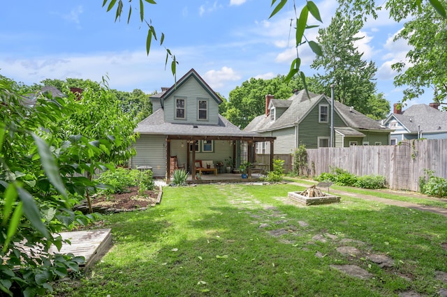 334 Oldham Ave, Lexington, KY 40502 - rear view of house with an outdoor fire pit and a patio