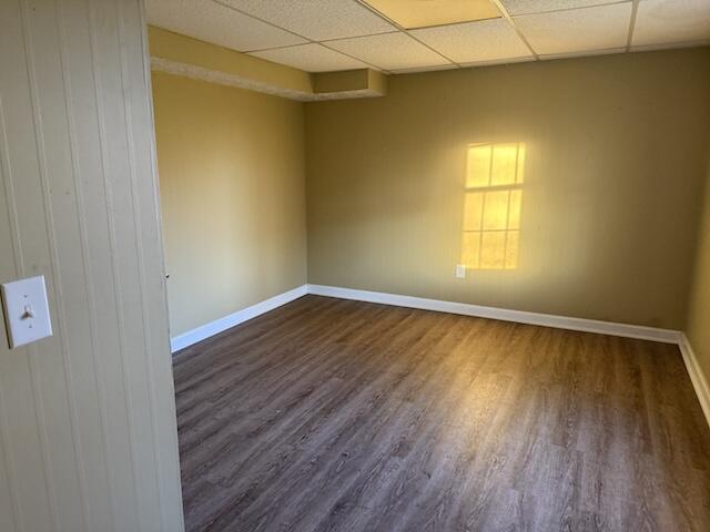 80 Panda Ln, Russell Springs, KY 42642 - spare room with dark wood-style flooring and a paneled ceiling