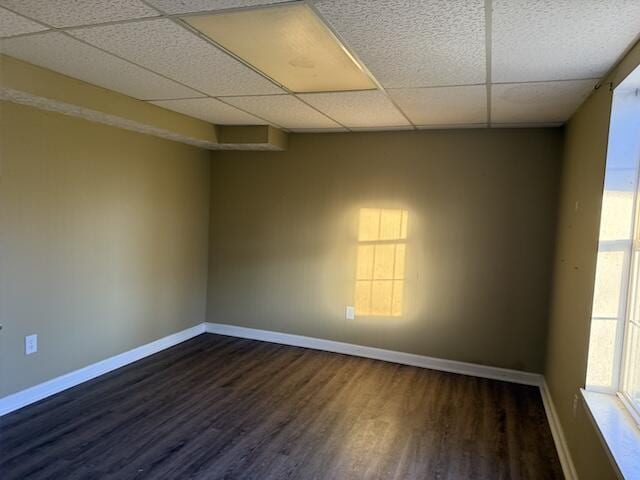 80 Panda Ln, Russell Springs, KY 42642 - spare room featuring a drop ceiling and dark wood-style flooring