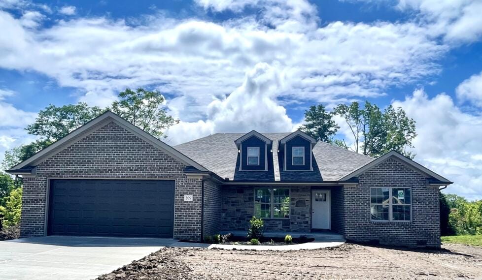 209 Patriot Trl, Berea, KY 40403 - view of front of property with concrete driveway, an attached garage, brick siding, and a shingled roof