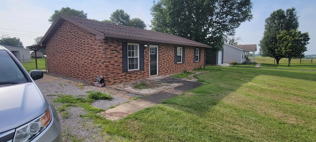 63 Mayme Ln, Stanford, KY 40484 - view of property exterior with brick siding and a lawn