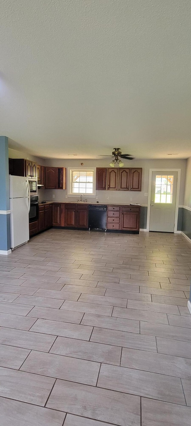 63 Mayme Ln, Stanford, KY 40484 - kitchen featuring black appliances, a textured ceiling, and wood tiled floors