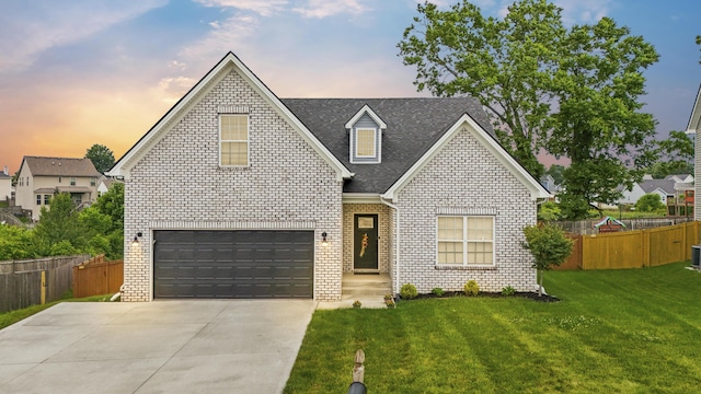 111 Kara Bryn Cv, Georgetown, KY 40324 - traditional-style home featuring concrete driveway, brick siding, roof with shingles, and an attached garage