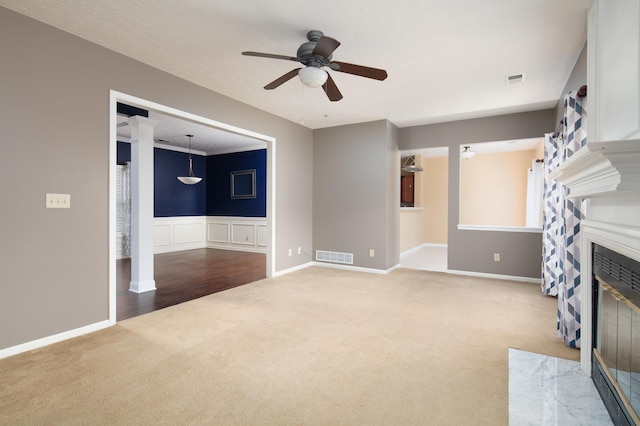 1204 Aldridge Way, Lexington, KY 40515 - unfurnished living room featuring carpet floors, a ceiling fan, a fireplace with flush hearth, and decorative columns
