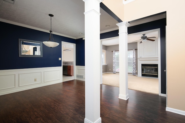 1204 Aldridge Way, Lexington, KY 40515 - empty room with ornate columns, a ceiling fan, dark wood finished floors, a fireplace with flush hearth, and crown molding