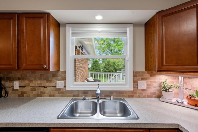 441 Cromwell Way, Lexington, KY 40503 - kitchen with brown cabinetry, light countertops, and tasteful backsplash
