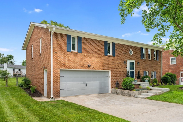 441 Cromwell Way, Lexington, KY 40503 - raised ranch featuring a garage, concrete driveway, and brick siding