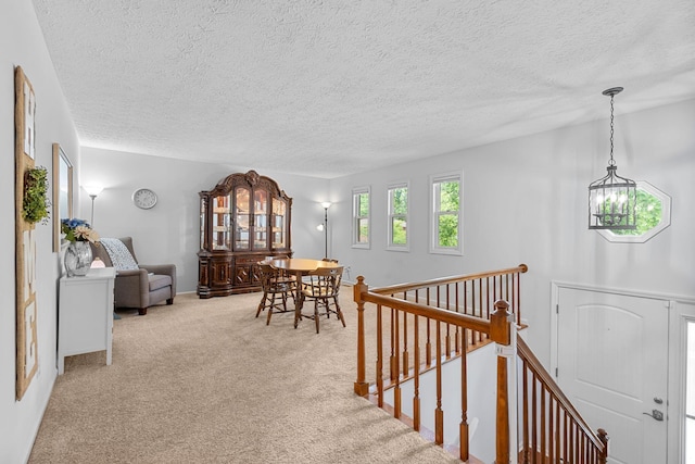 441 Cromwell Way, Lexington, KY 40503 - hall featuring an upstairs landing, a textured ceiling, and carpet flooring